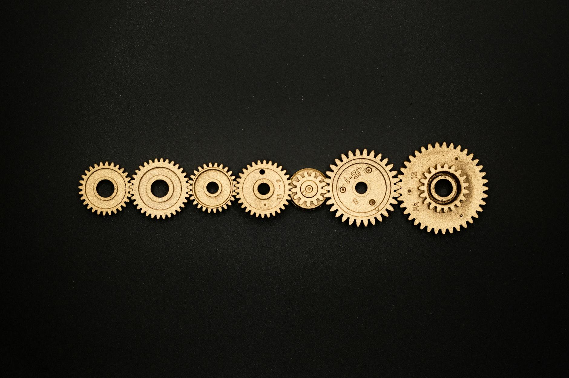 photo of golden cogwheel on black background